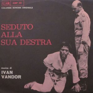 IVAN VANDOR SEDUTO ALLA SUA DESTRA